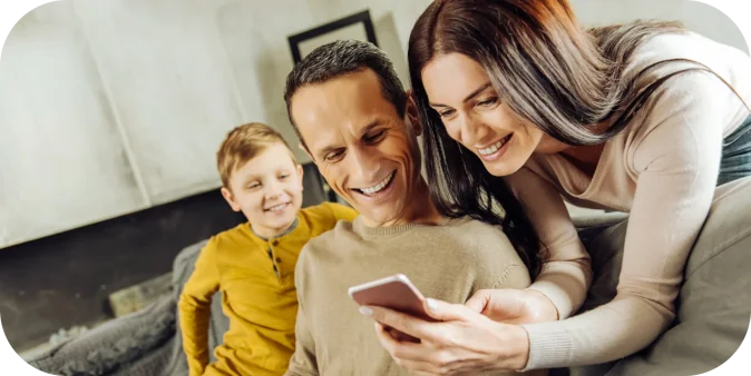 your-opinion-cheerful-young-woman-leaning-back-couch-showing-her-husband-photos-her-phone-while-man-laughing